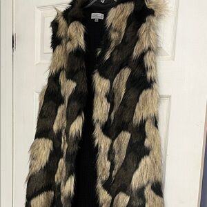 Luxurious Faux Fur Vest in Black and Tan. Lined in taffeta with knitted backside